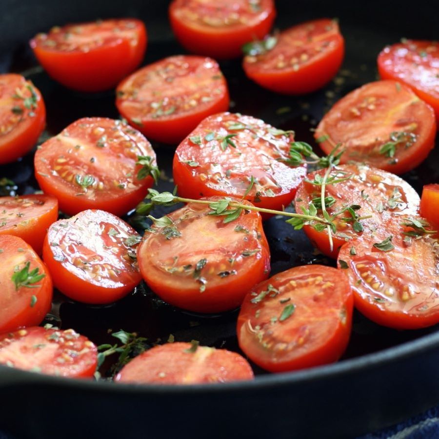 Tomatoes cooking in a pan